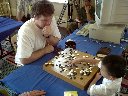 6-year-old Liao Xingwen defeats top program at Go